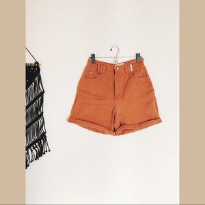 Terra-cotta colored high waisted mom shorts